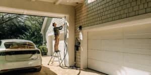 Electrician installing a Level 2 EV charger in a Florida garage