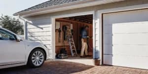 Electrician installing a Level 2 EV charger in a Florida garage